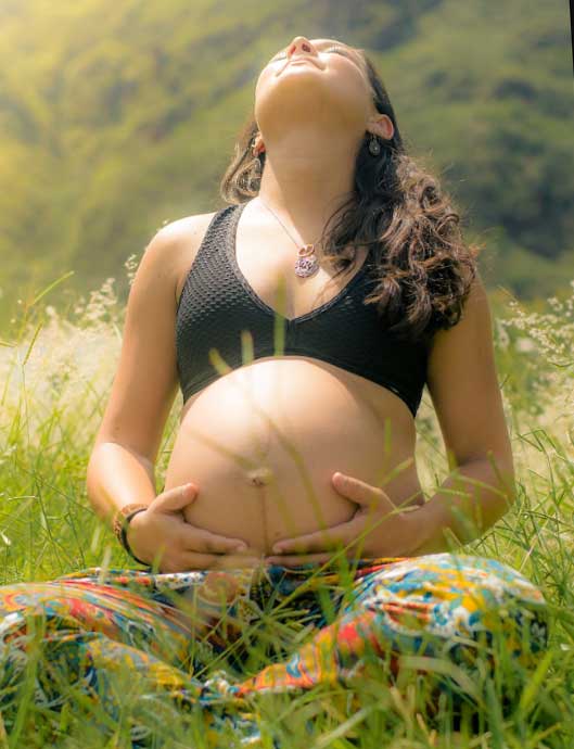pregnant woman in the grass