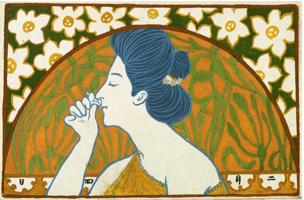 Woman sniffing a flower