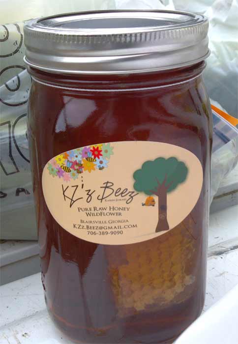 Local honey in jar with comb