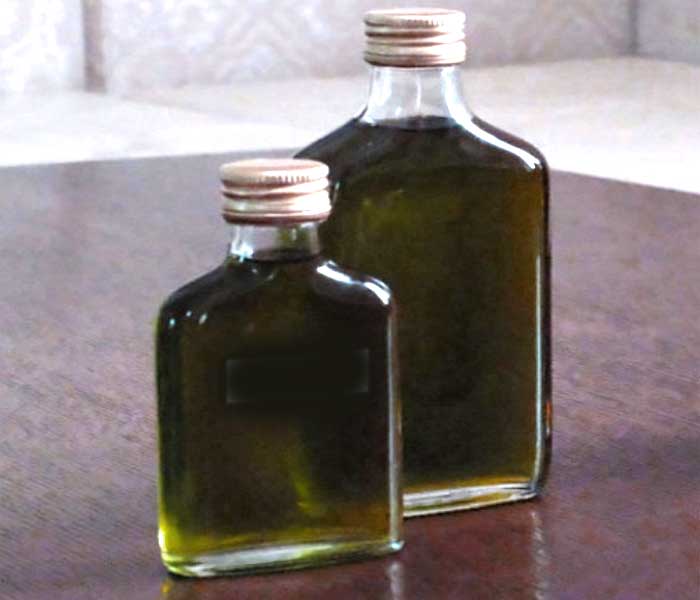 Infused herbal oil in bottles