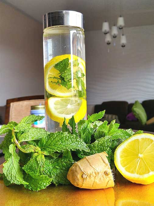 Mint,  lemon, and ginger herbal drink