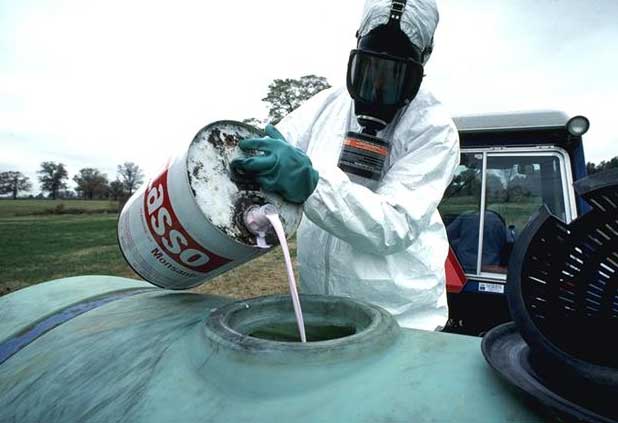 Mixing pesticides to spray on crops