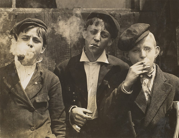 3 young guys smoking cigarettes